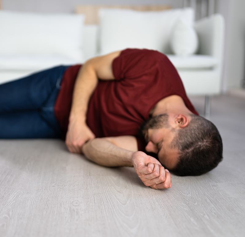 Unconscious Young Man Lying On Floor Unconscious Young Man Lying On Floor